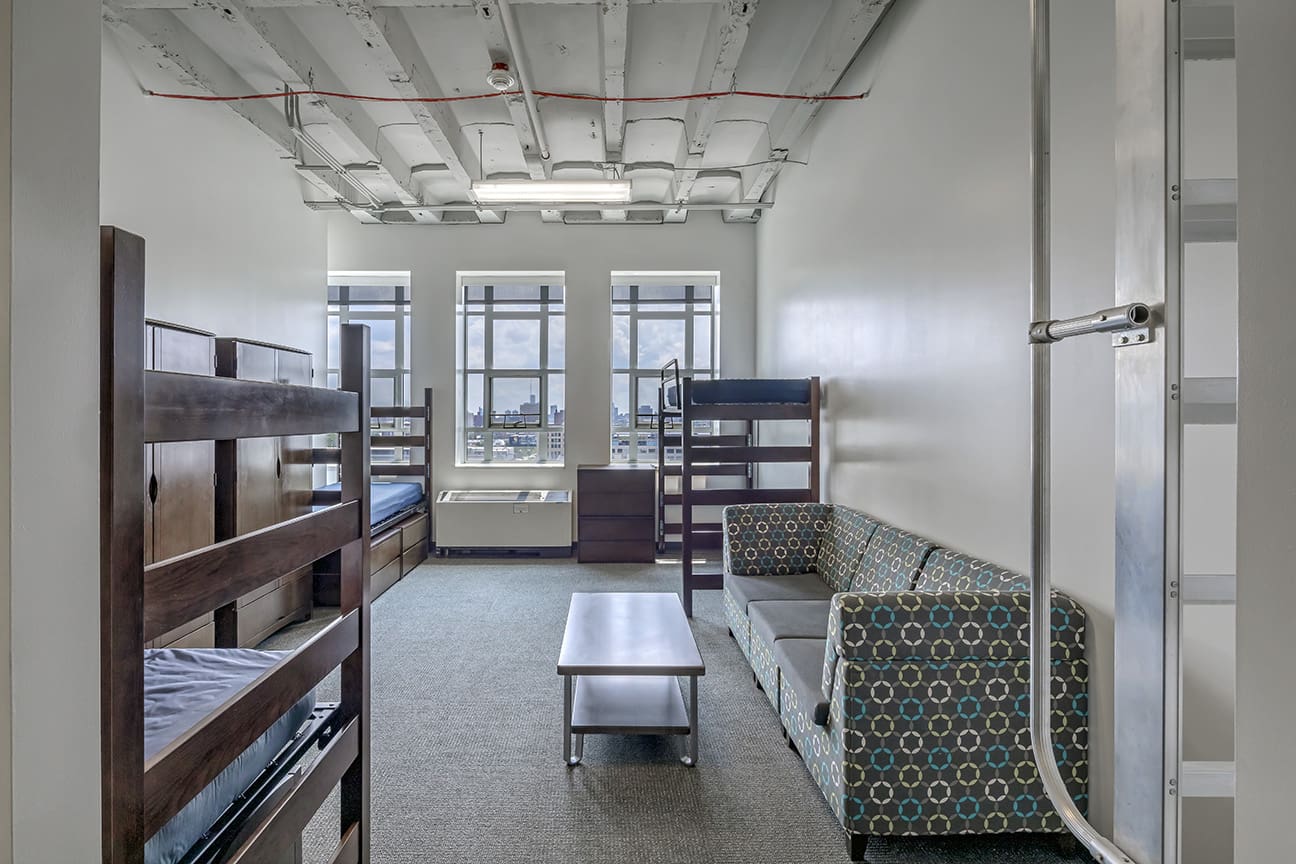 A photograph of a three person dorm room in the Taubman Center student housing.