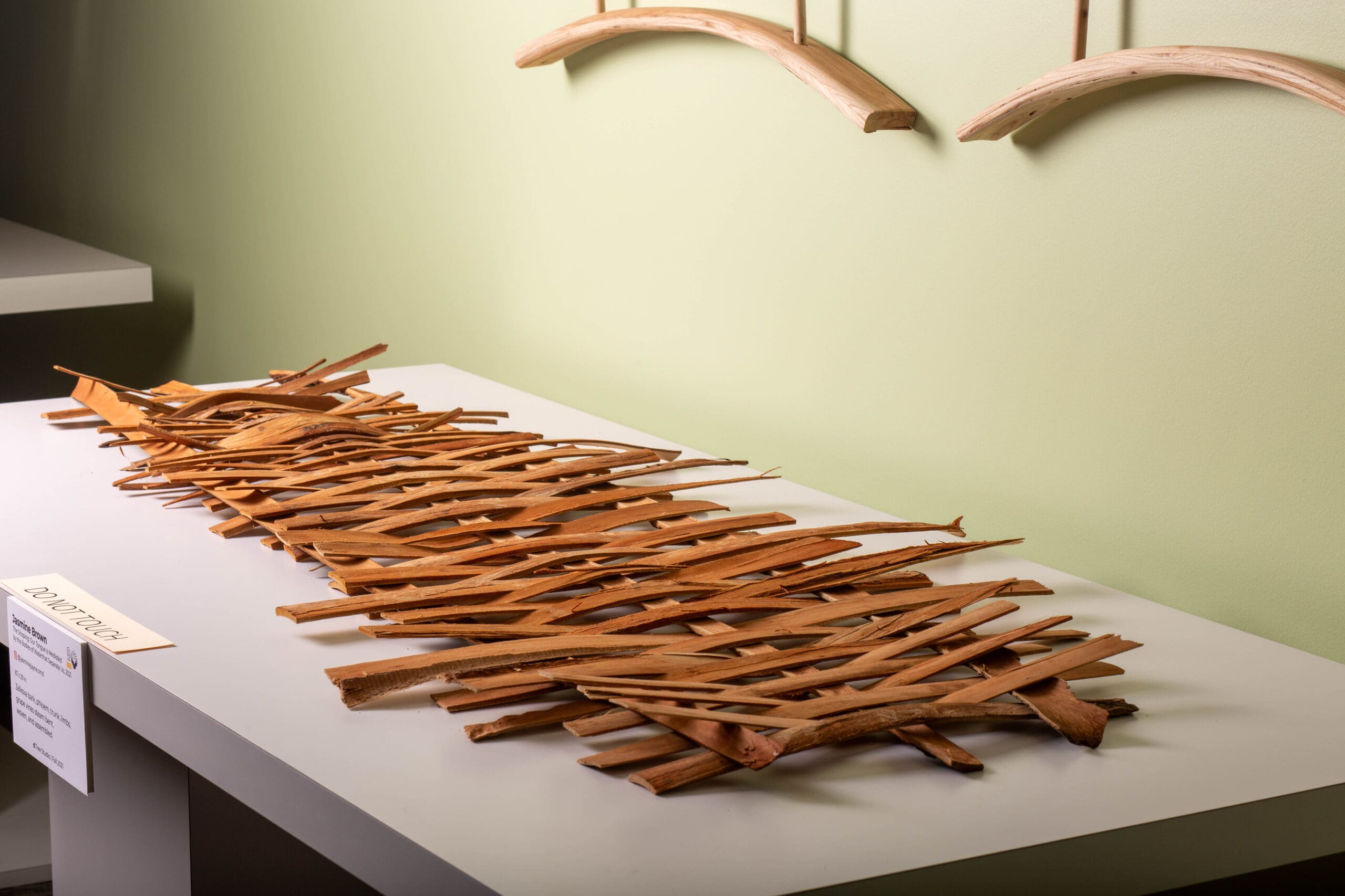 artwork that is pieces of zvelka wood woven together on display at the Wright Muesum