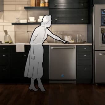 Photo of a kitchen with a digital model of a woman touching the countertop.