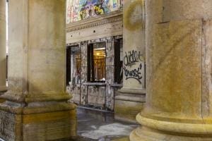 Interior of an abandoned and graffitied theatre.