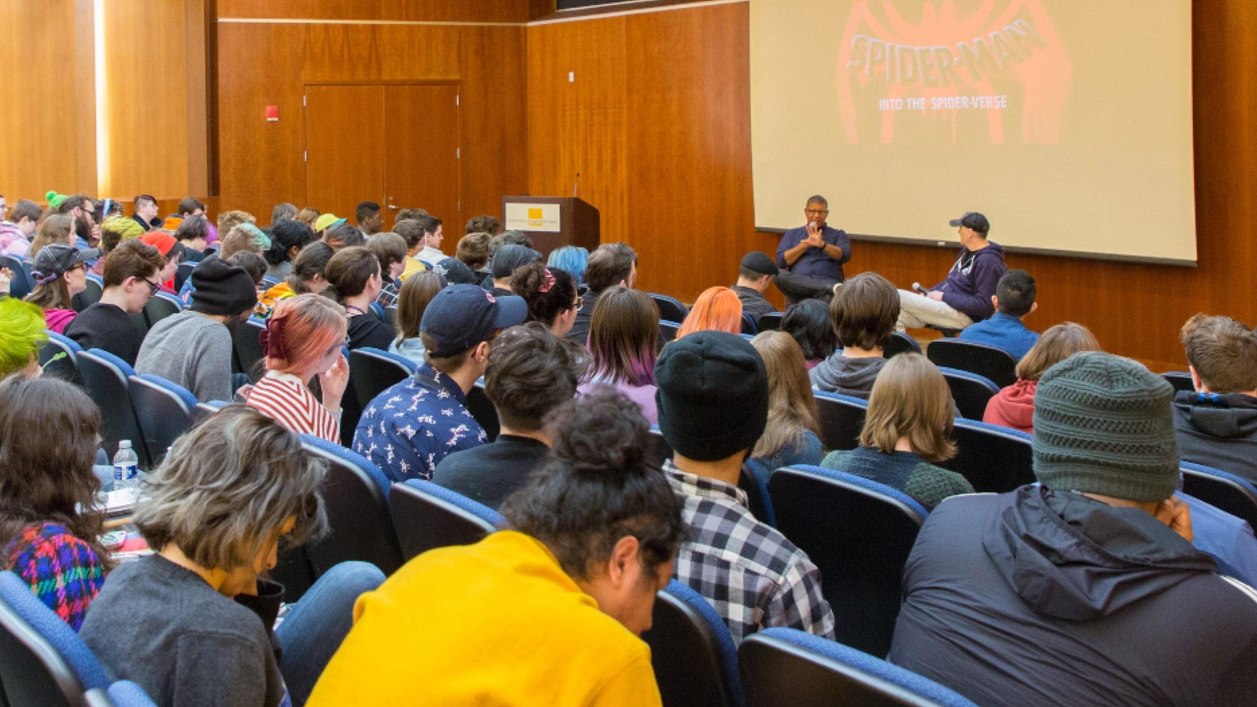 students in a lecture hall listening to a guest lecturer