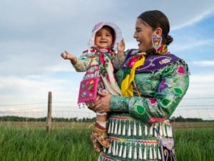 Indigenous mother and child in traditional dress 