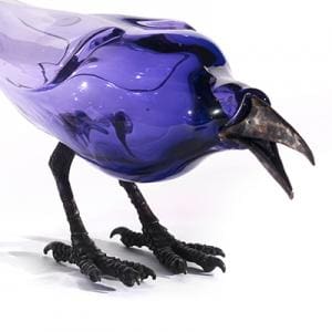 Photo of a product design of a machine shapes like a blue bird with black claws and an open pointy beak.