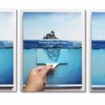 Three identical posters on a white background. The poster shows a small island on the water, with a large stretch of ocean below it. A hand demonstrates how there is a tab you can pull, which reveals a giant mountain of trash below the island in the water.