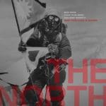 Magazine cover that features a black and white image of a mountain climber on the top of Mt. Everest. Red semi-transparent text in the bottom right corner reads "The North Face".