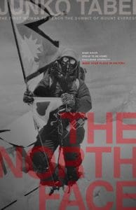Magazine cover that features a black and white image of a mountain climber on the top of Mt. Everest. Red semi-transparent text in the bottom right corner reads "The North Face".