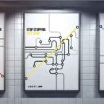 Photo of three posters on a white tile wall. The posters are black and white simplistic drawings of subway train maps, with either a red, yellow, or blue line cutting across the entire map. Text in the top corners reads "Stop stopping. Just jump."
