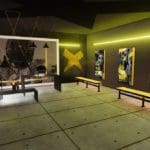Digital rendering of the inside of a sport's changing room. The lights are yellow and the benches are black metal with yellow seats. One wall is covered with a giant black and white photo of a football player with huge text that says "It's your game". The other wall has three similar looking posters, but with different images and slogans.