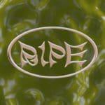Shiny stylized tan text that says "Ripe" inside an oval ring of the same color. Pictured on top of a shiny green abstract background.