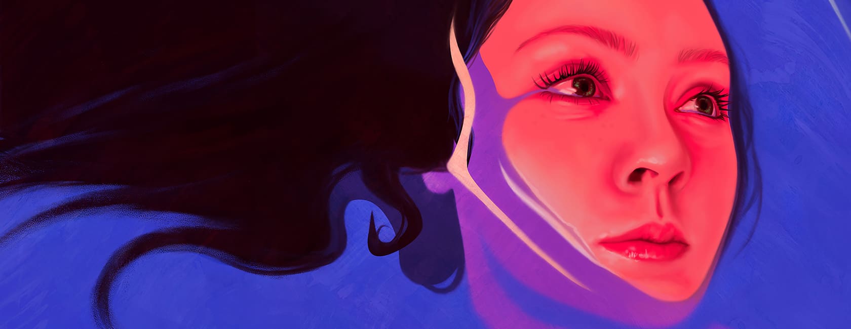 A woman's face poking out of water looking up and to the right.