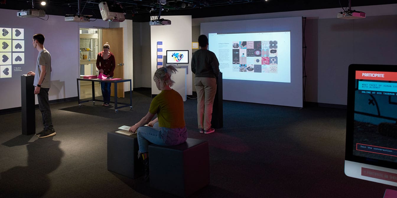 Photo of four people in an interactive UI/UX exhibition