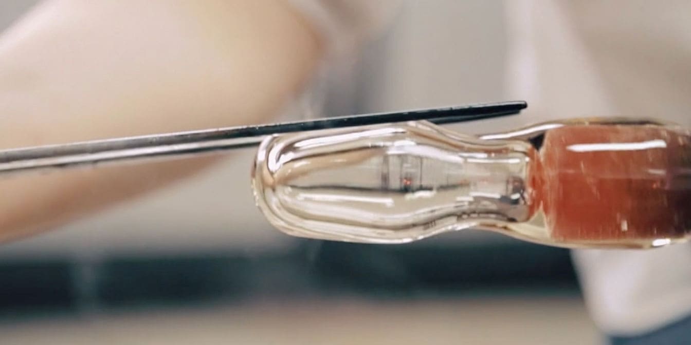 Closeup photo of someone sculpting molten glass