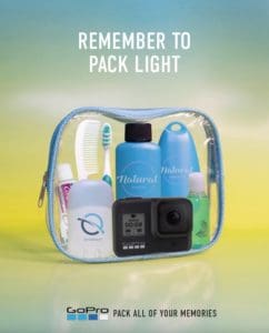 Print Advertisement for GoPro with the tagline "remember to pack light". Depicts a clear travel back with toiletries. 