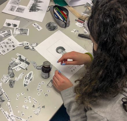 communication design projects student creating work by cutting and gluing project