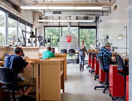 Photo of many students working in a Crafts and Materials studio during the day.