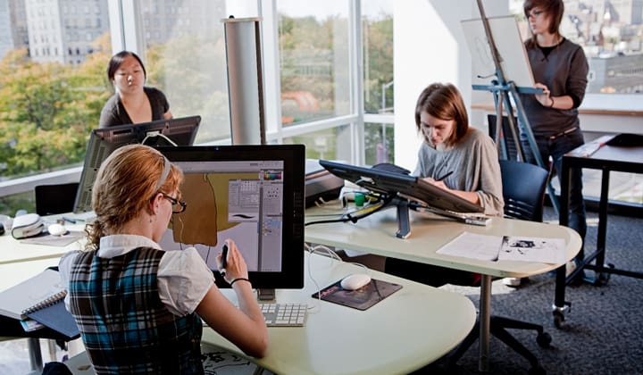 students studying illustration using state of the art tablets