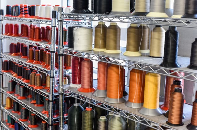 various spools of colored thread in a studio