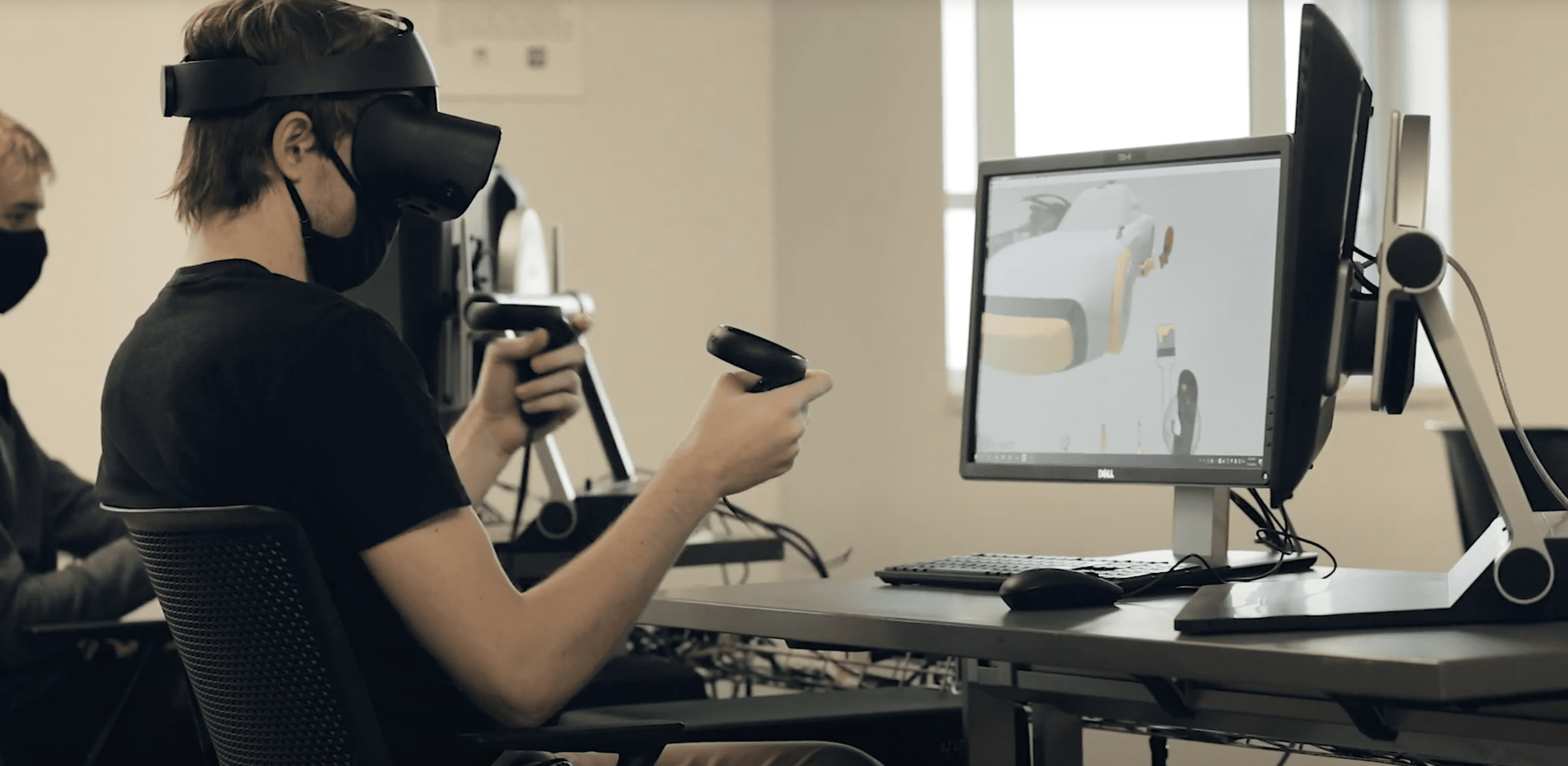 Image of a student wearing a virtual reality headset in a Transportation Design class
