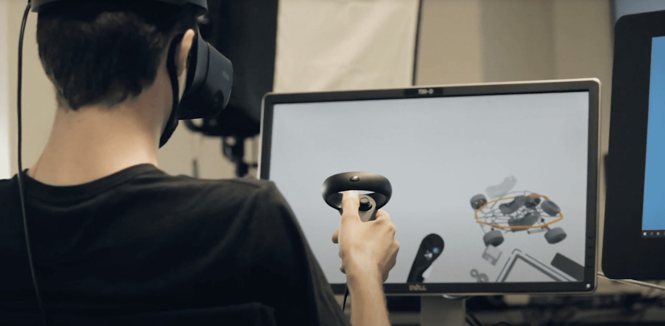 Image of a student using virtual reality headset to design a car for Transportation Design