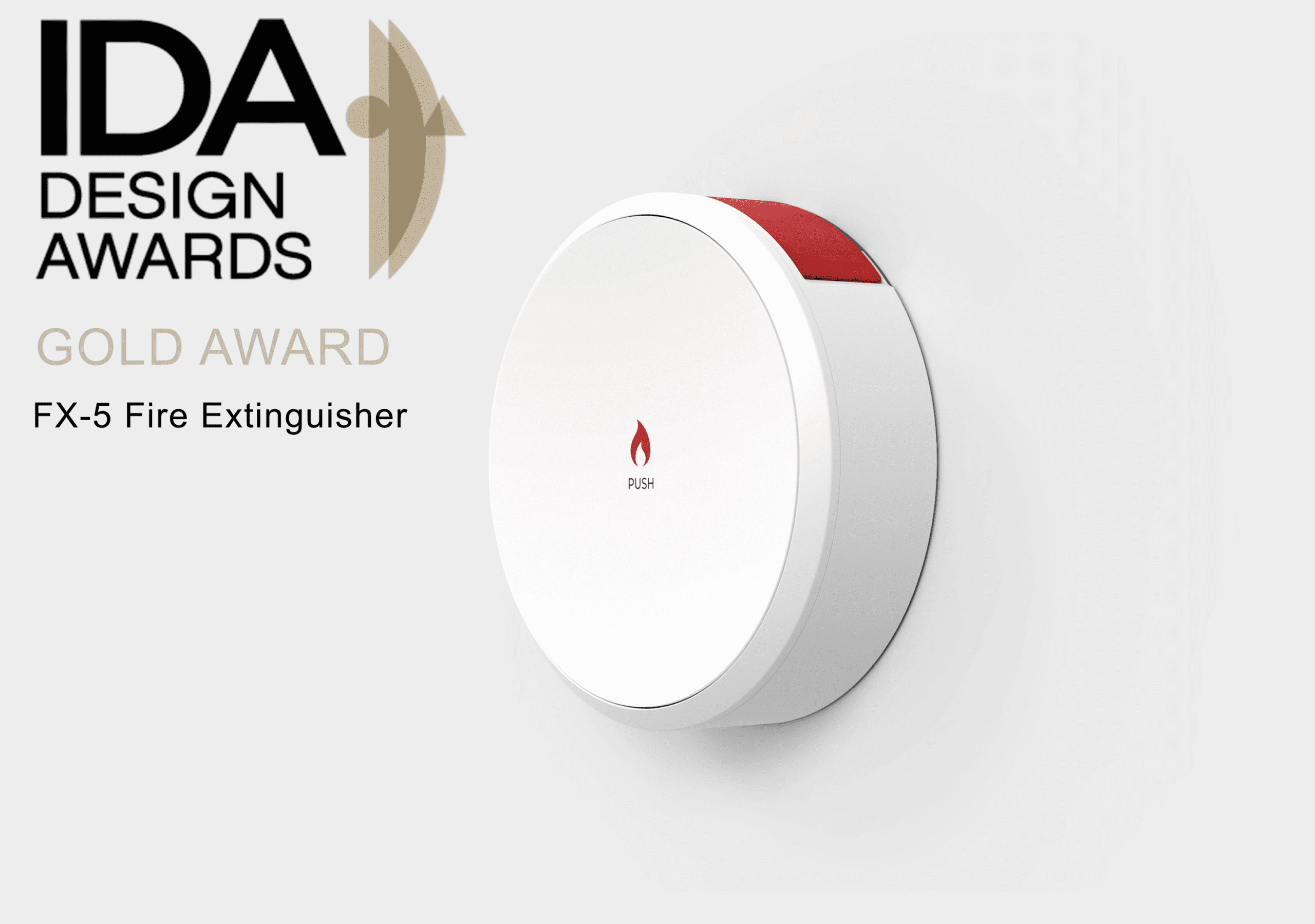White circular fire extinguisher with a red button on the top and a red fire symbol with the word "Push" in the center. Pictured on a white wall. The title says "IDA Design Awards. Gold Award. FX-5 Fire Extinguisher."