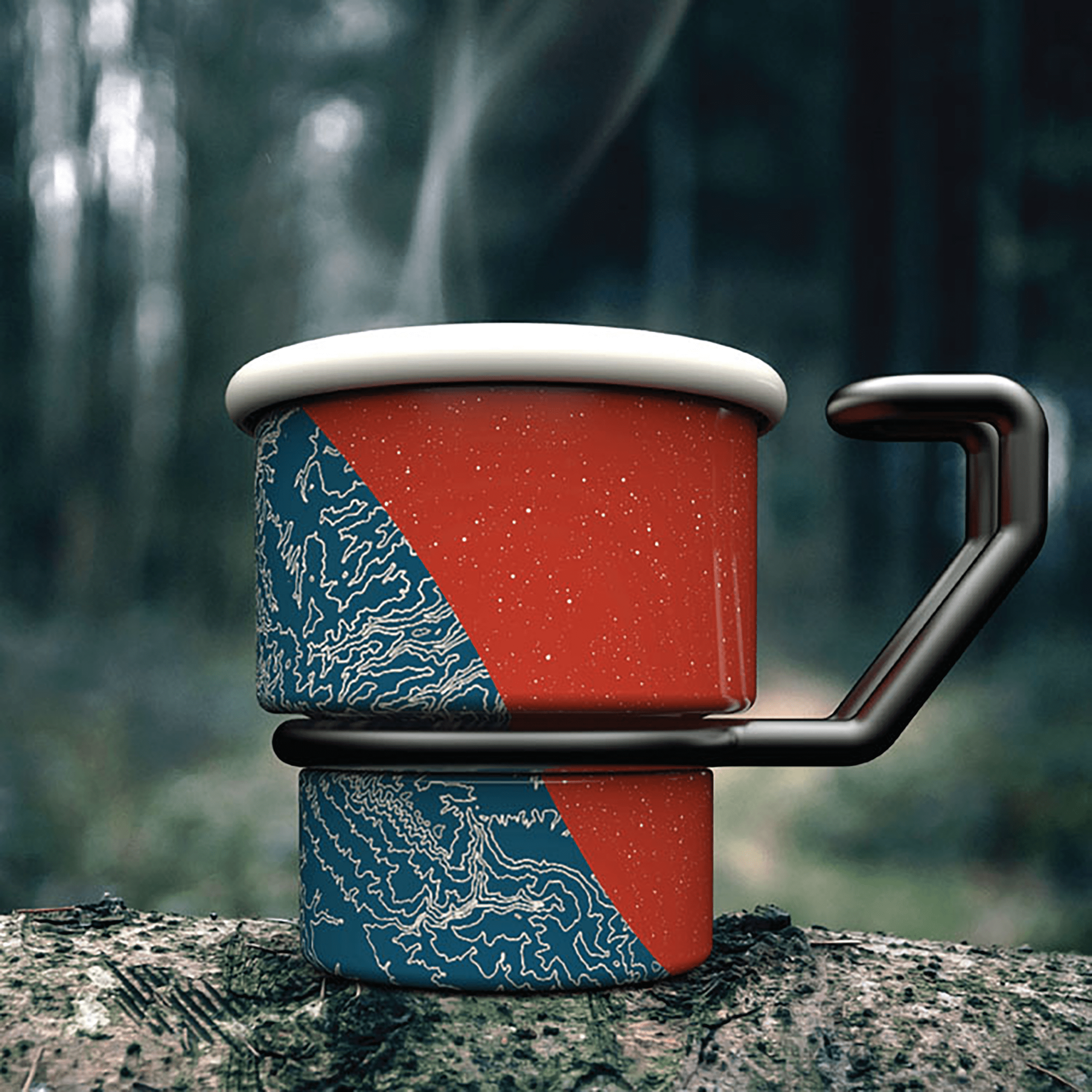 Image of a short travel mug pictured sitting on a rock with a forest in the background. The mug is half red with white speckles, and half blue with white swirls. It also has a whire rim and a black curved handle.