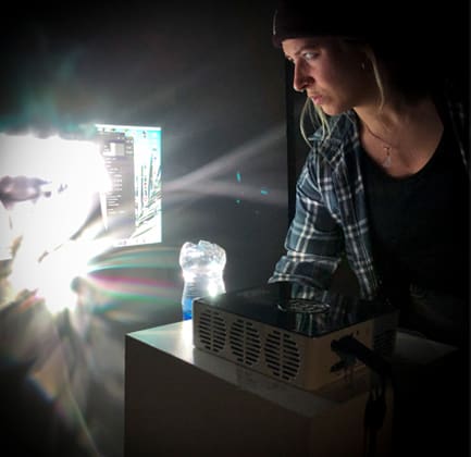 Photograph of a student using a projector