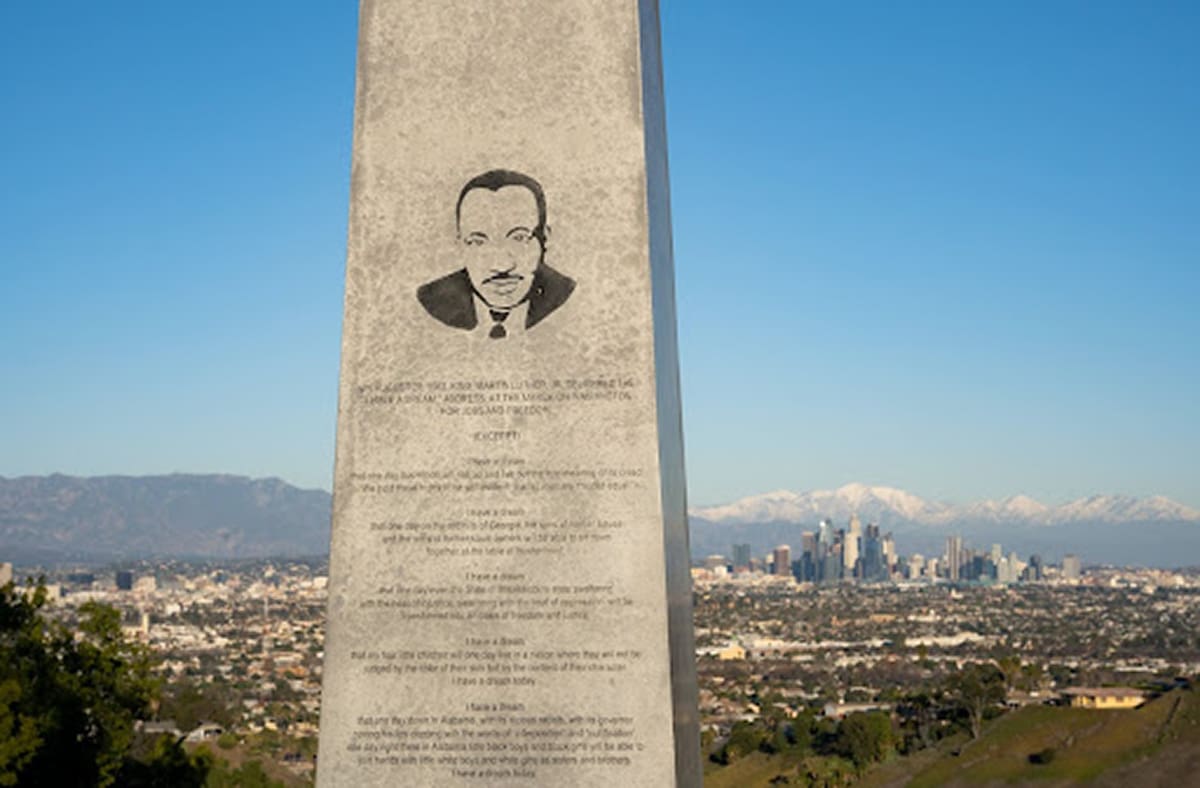 Martin luther kings image imprinted on a monument with words from the 