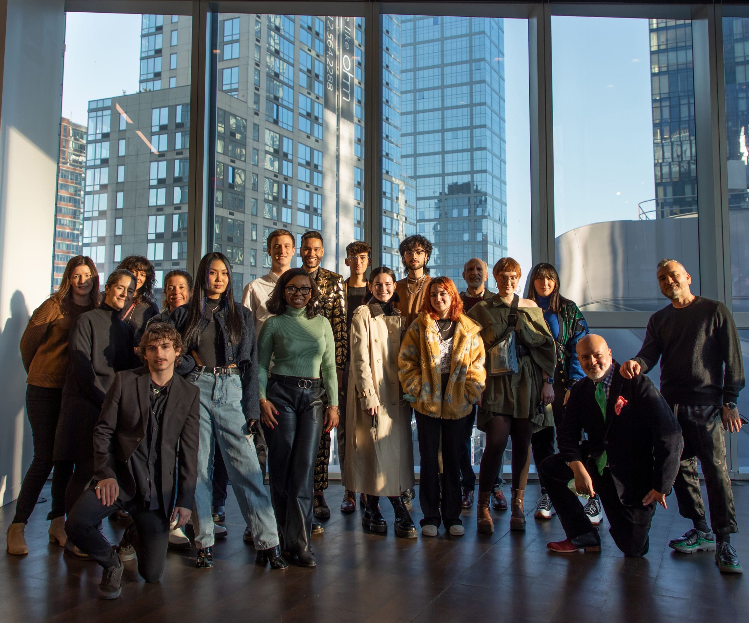 group of students gather for a picture at Stuart Weitzman's headquarters in NY