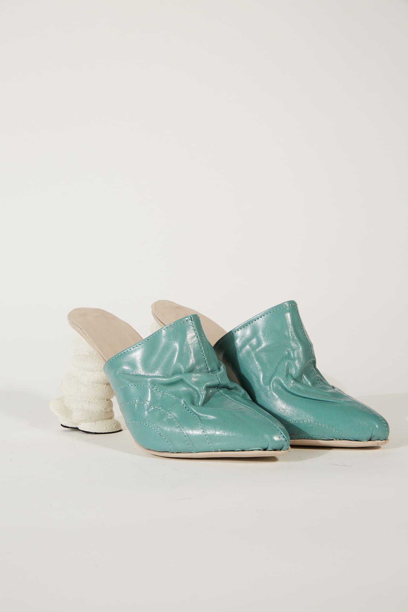 teal leather mules with white cloud heals