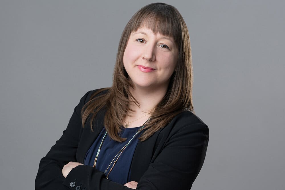 headshot of alumna Nina Bianchi in front of a grey background