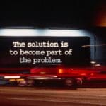 a print advertisement that says "The solution is to become part of the problem"