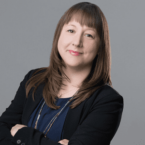 headshot of alumna Nina Bianchi in front of a grey background