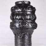 artwork of Ebitenyefa Baralaye. Black ceramic vase with ridges.