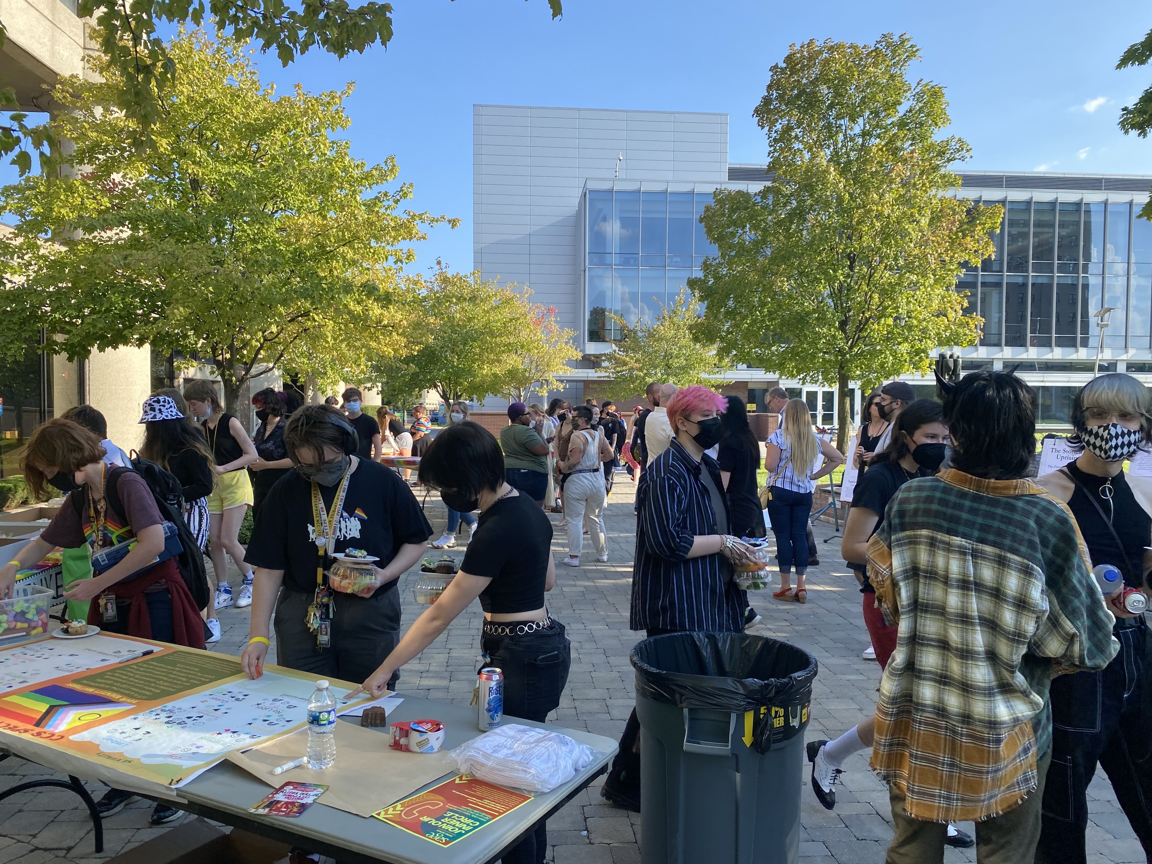 Students socializing at the CCS pride picnic outdoors