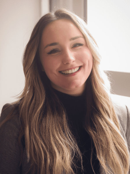 Amber Zundel headshot near a window