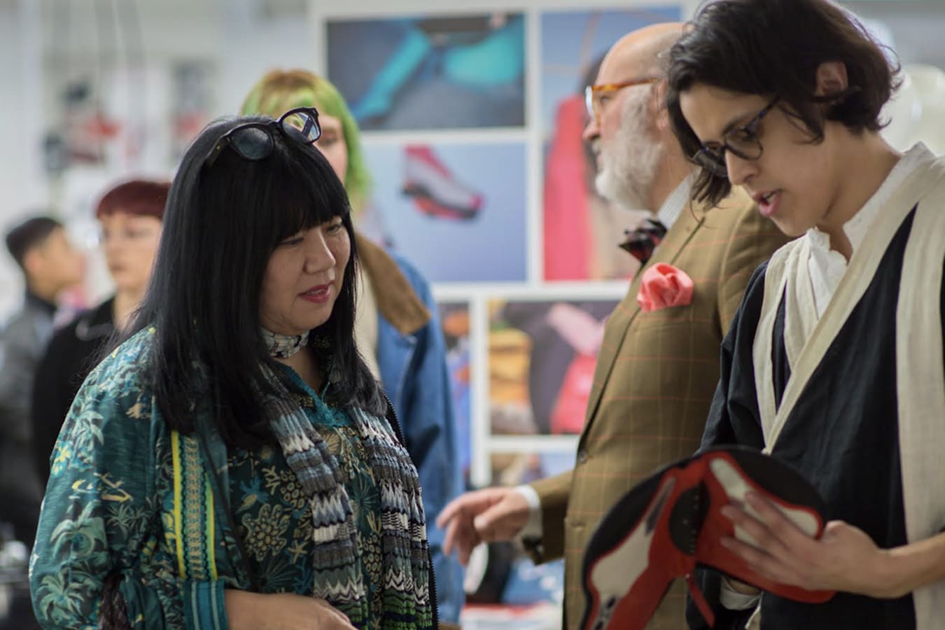 Fashion Designer Anna Sui viewing the work of fashion design students