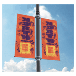 multicolored city welcoming flags on a flagpost - designed by Communication design faculty Andrew Kopietz