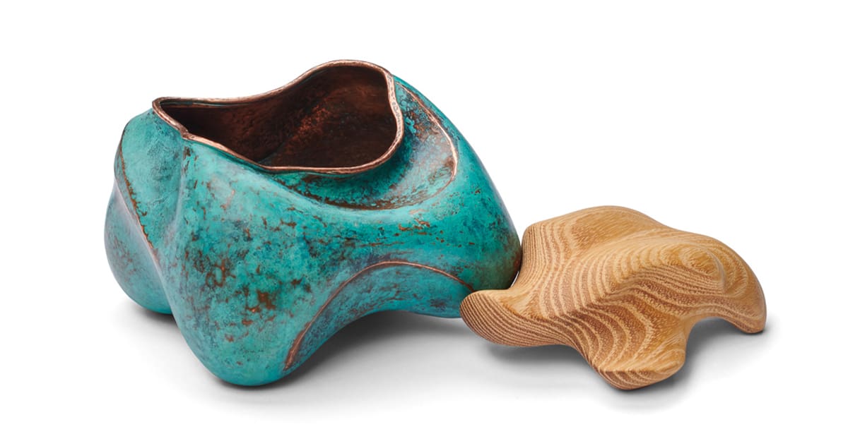 turquoise ceramic bowl with a wood like star next to it