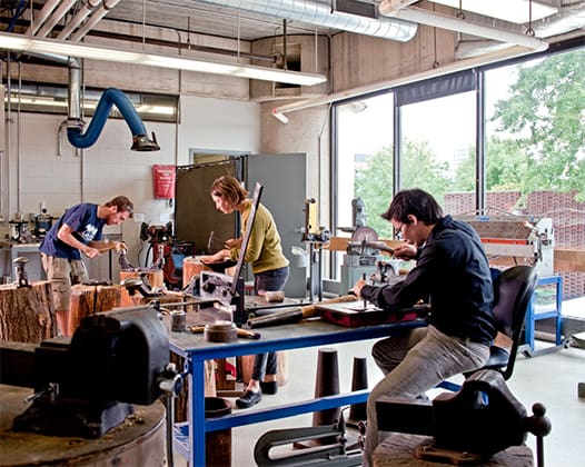 students working with metal in the metalshop