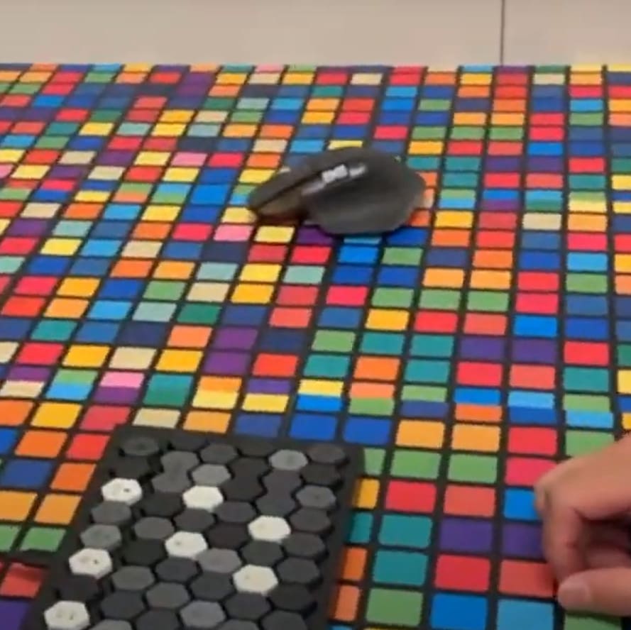board with colorful boxes and some gray, black and charcoal hexagons