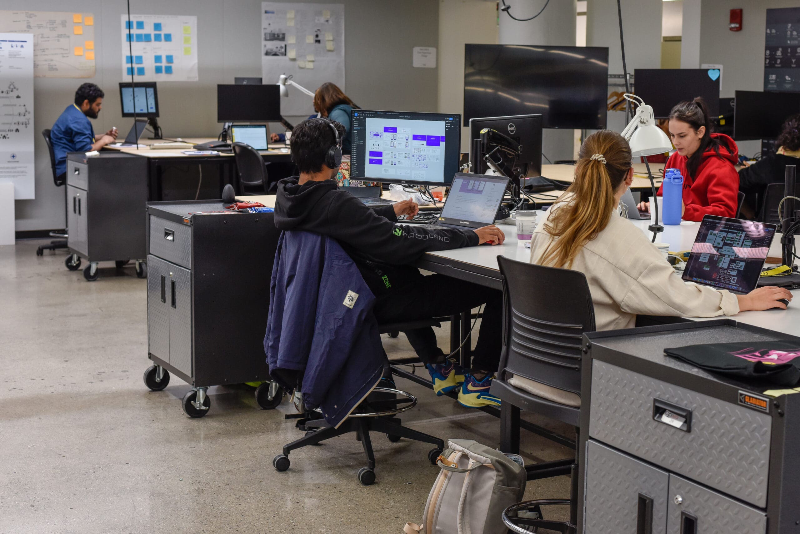 Various students working in a computer lab