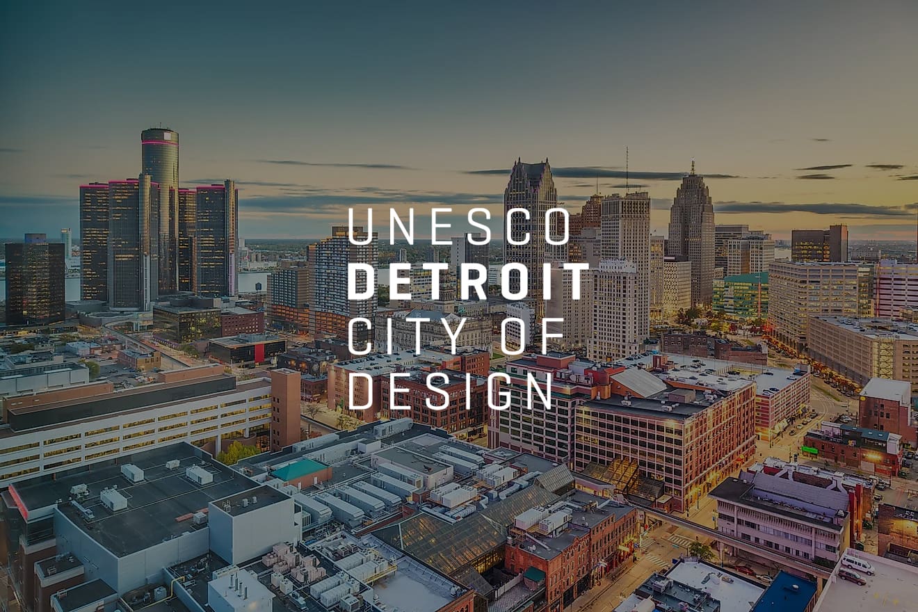 Image of the city of Detroit paired with a UNESCO City of Design logo