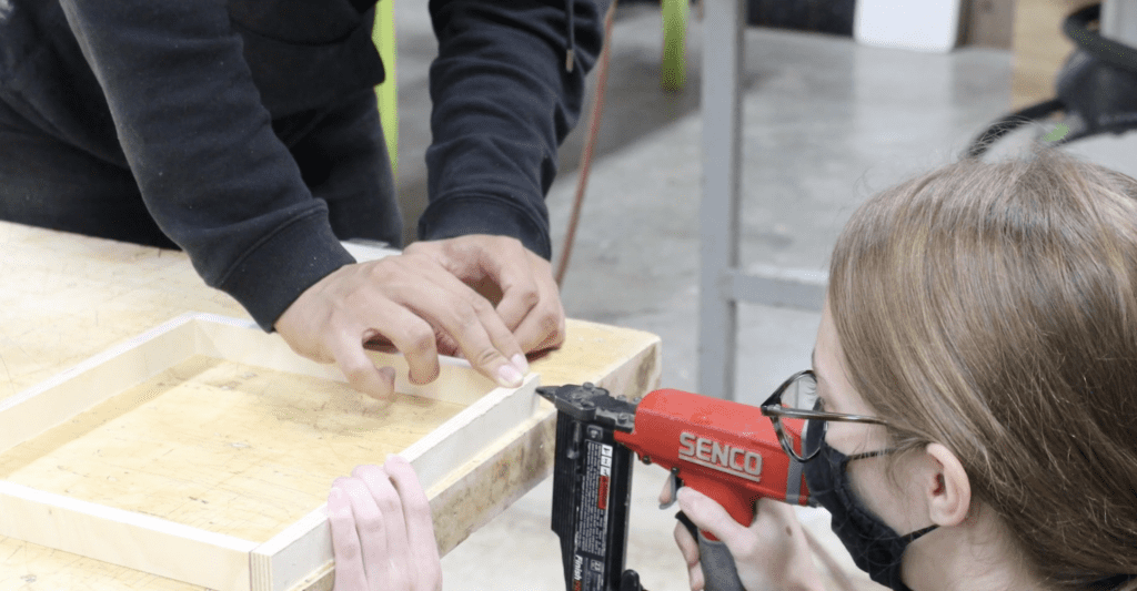 Students building the mold containers for testing