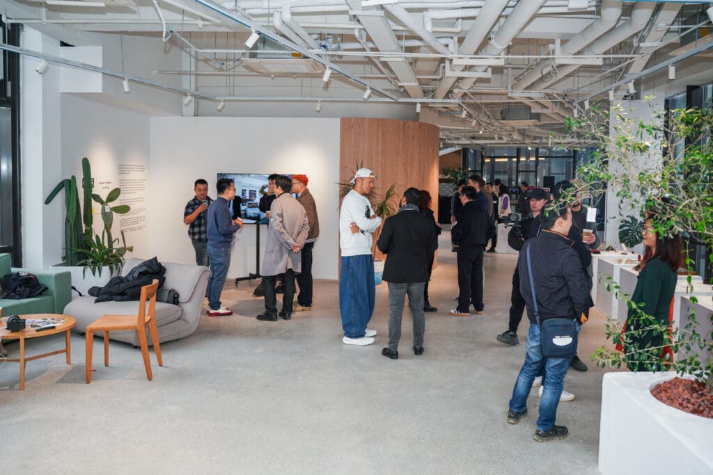 Alumni mingle in a large space in Shanghai