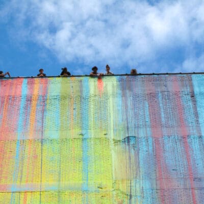 mural made with rainbow paint running down a building