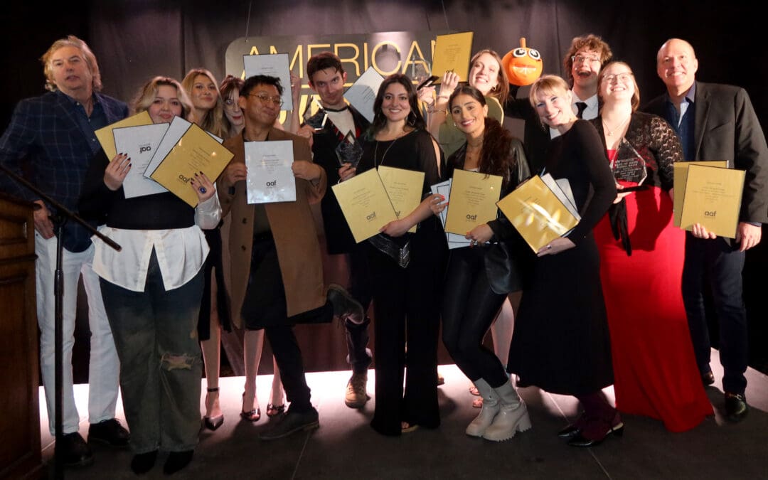 students gather with their awards at the ADDY awards