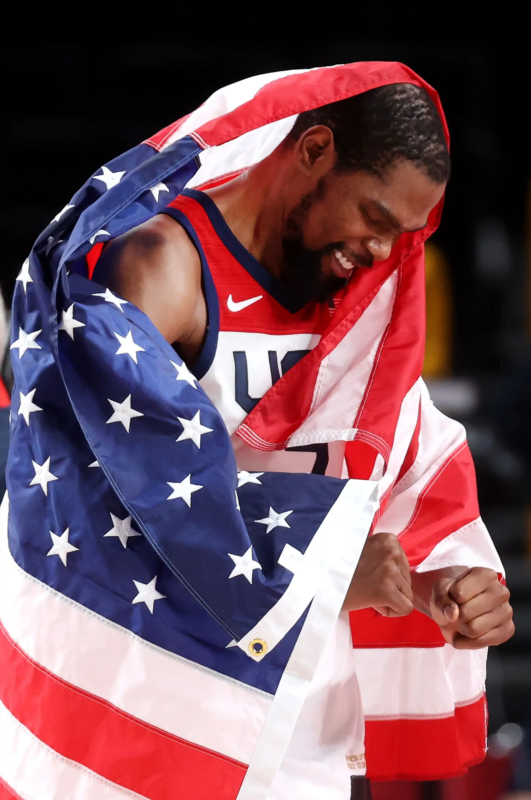 Kevin Durant #7 of Team United States celebrates following the United States' victory over France in the Men's Basketball Finals game on day fifteen of the Tokyo 2020 Olympic Games at Saitama Super Arena on August 07, 2021 in Saitama, Japan.