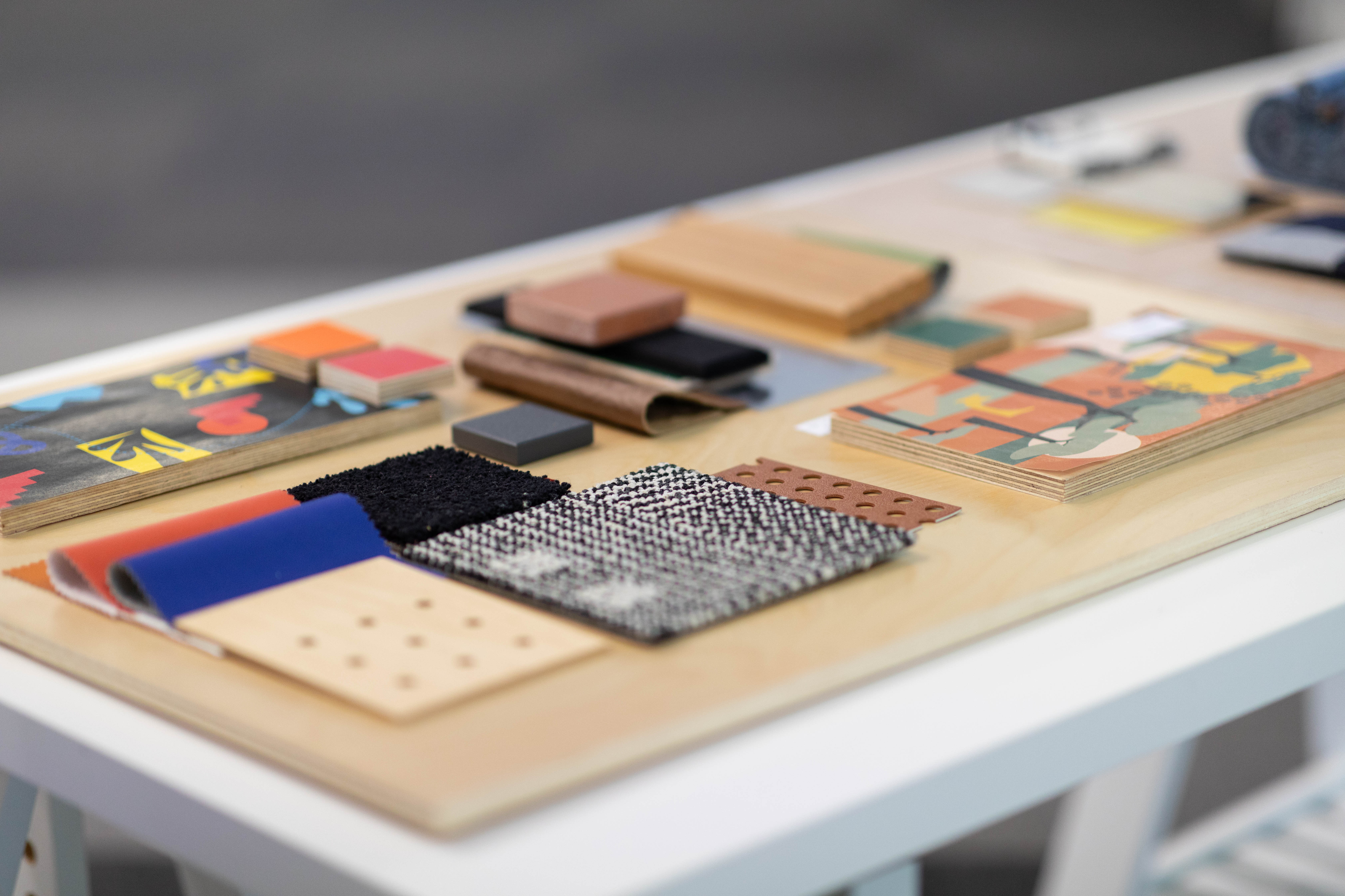C.L.A.S.S. Project Material Board A wooden board with multiple color and material samples.