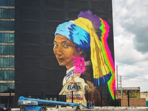Sydney G. James, ‘01 Illustration - “The Girl with the D Earring” mural painted on a black wall, a modern Detroit take on Dutch painter Johannes Vermeer’s “Girl With a Pearl Earring.”
