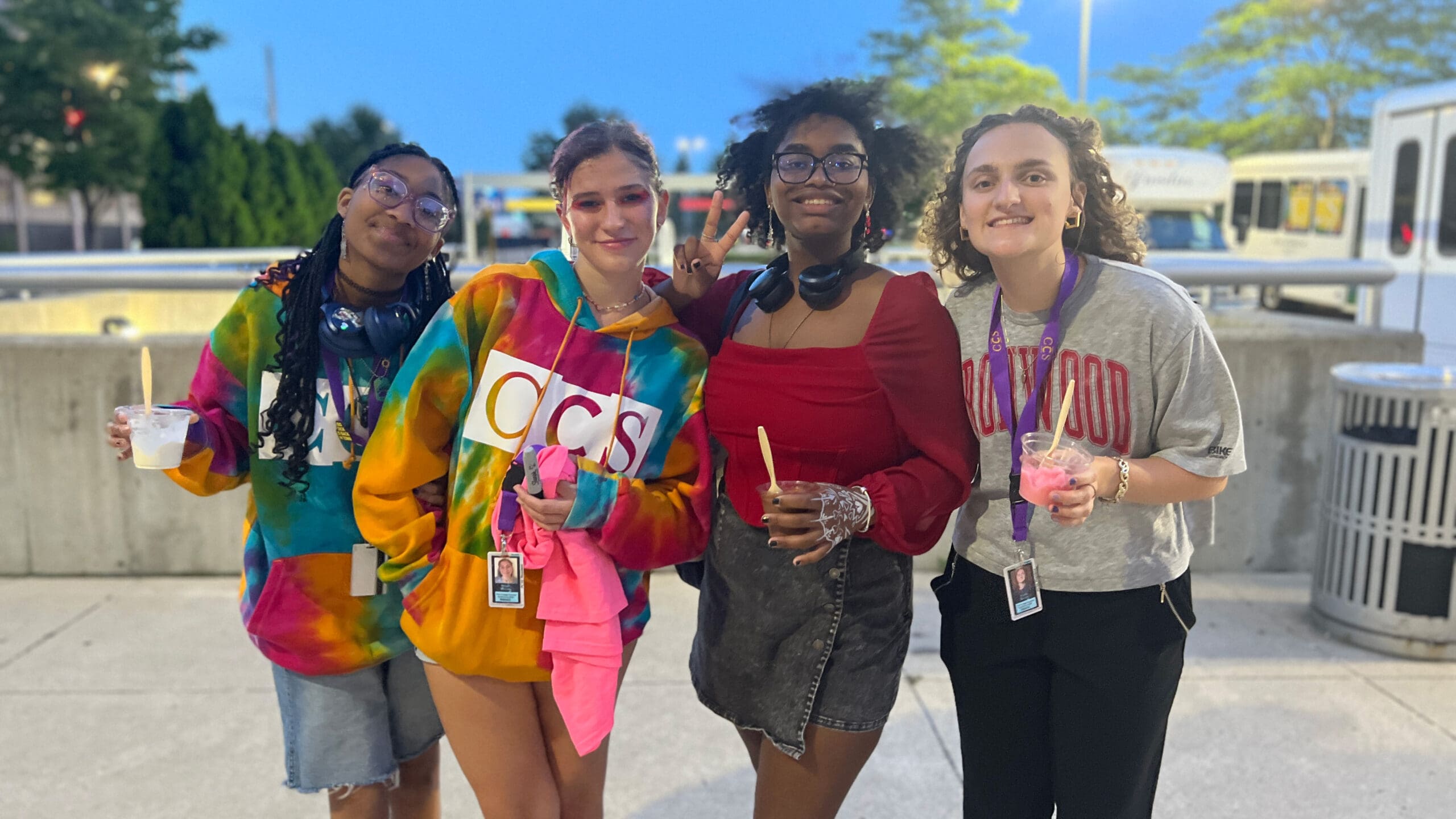 Four CCS Precollege Summer Experience students flash smiles while standing next to each other.